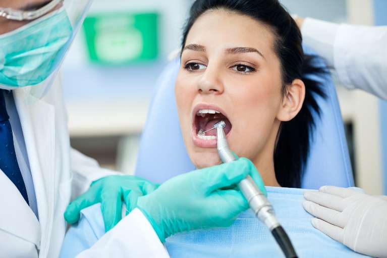 brockport woman getting teeth cleaned 
