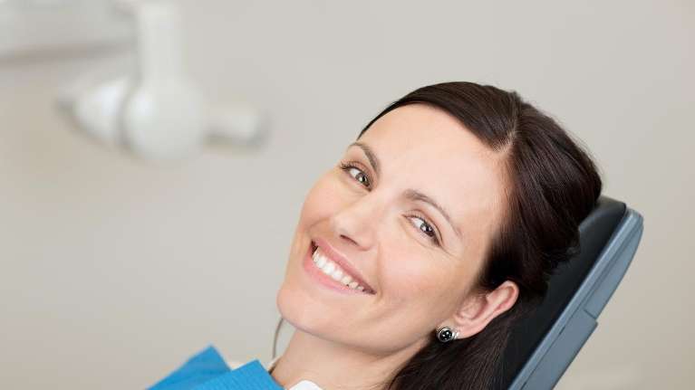 woman smiling in dental chair